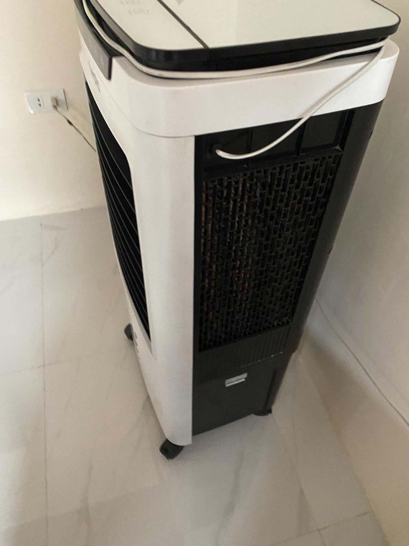 Iwata Air Cooler x100r (Category: Air Conditioning and Heating) located in Cavite. Submitted by argeteherbert03 (Listing ID 1466948158, Image 2). Description: - Brand: Iwata - Color: White body with black front grille and control panel - Controls: Digital touch buttons on top panel (Swing, Breeze, Timer, Cool, Speed functions) - Water Refill: Convenient top-opening water compartment for easy filling - Portability: Mounted on smooth caster wheels 