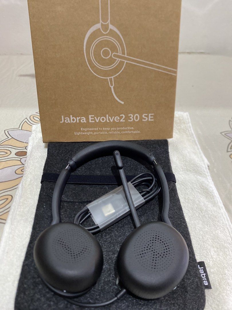 Jabra Evolve2 30 SE On-Ear Headset (Category: Headphones & Headsets) located in Rodriguez. Submitted by angelshoppe (Listing ID 1466780809, Image 2). Description: - Model: Jabra Evolve2 30 SE Wired Headset - Color: Sleek black with a lightweight build - Connectivity: USB connection - Features: Adjustable headband and boom microphone - Inclusions: Grey fabric storage pouch and original box - Condition: Clean and ready for work setups or calls.