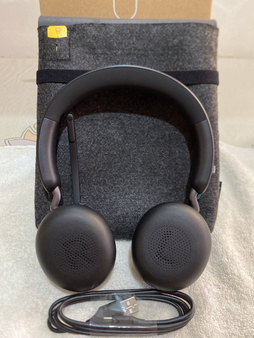 Jabra Evolve2 65 Wireless Headset with Case and Cable (Category: Headphones & Headsets) located in Rodriguez. Submitted by angelshoppe (Listing ID 1466781965, Image 2). Description: - Model: Jabra Evolve2 65 Wireless Headset - Features: Built-in boom mic on the right side, great for work calls and everyday listening - Inclusions: Charging cable, grey felt carrying pouch, and original box .