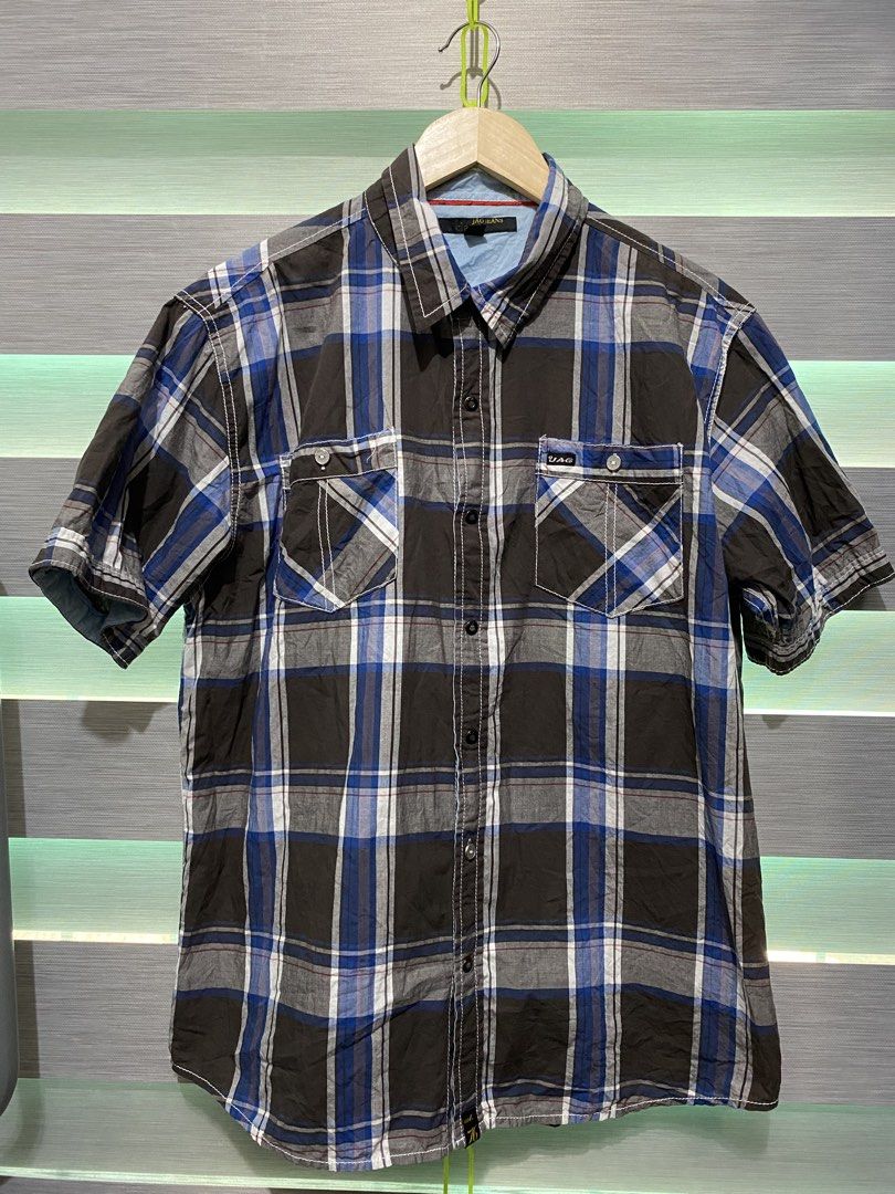 JAG Jeans Plaid Short Sleeve Button Down Shirt (Category: Activewear) located in Butuan. Submitted by nielben13 (Listing ID 1466849494, Image 1). Description: - Brand: JAG Jeans - Style: Short-sleeve button-down shirt - Design: Brown, blue, white, and grey plaid pattern - Material: 100% cotton for all-day comfort - Features: Standard collar, two front chest pockets with button flaps and contrast stitching - Bonus: Extra spare button attached insi