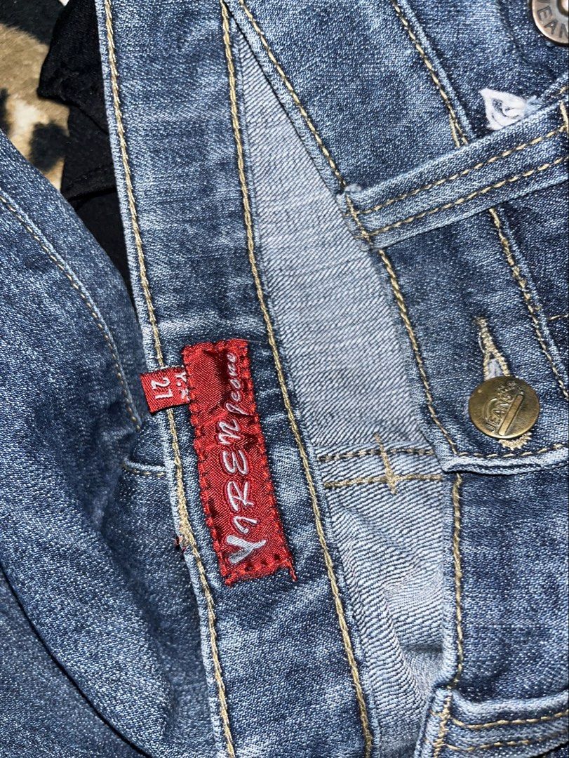 Jeans Flare Denim Pants Size 27 (Category: Jeans) located in Talisay. Submitted by kitsaidy (Listing ID 1466939229, Image 2). Description: Yuren jeans in medium wash blue denim. Classic flare leg cut with slight distressing and whiskering details on the front. Back pockets have button flaps with contrast stitching. Tagged size 27. Great everyday wardrobe staple..