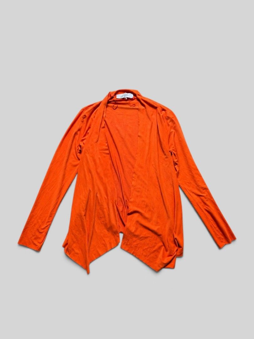 Jeff Gallano Orange Open Front Cardigan Size 1 (Category: Coats, Jackets and Outerwear) located in Rizal. Submitted by stoo_cee (Listing ID 1466927785, Image 1). Description: - Brand: Jeff Gallano - Color: Vibrant bright orange - Size: Tag 1 - Style: Open-front cardigan with a draped, flowing hemline and long sleeves - Material: Lightweight fabric with a soft touch - Details: Includes satin ribbon straps near the neckline - Condition: Excellent.