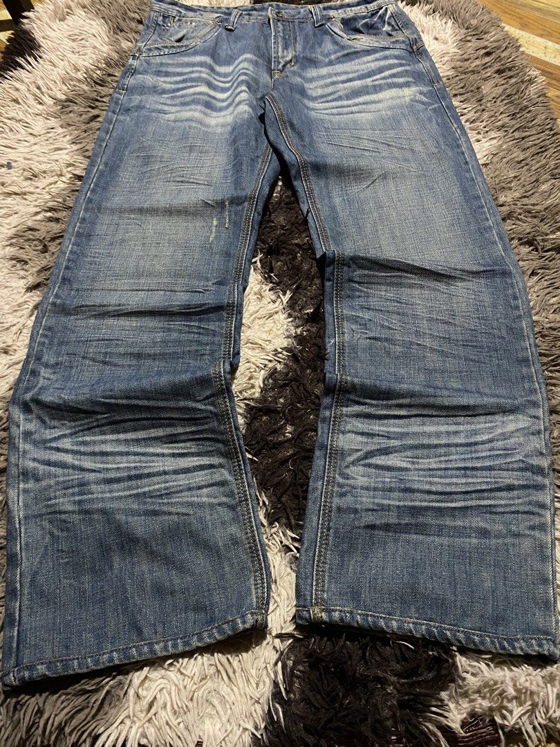 J&G Made In Italy bootcut (Category: Jeans) located in Caloocan City. Submitted by remythrift (Listing ID 1466912791, Image 2). Description: - Brand: J&G (Made in Italy) - Size: 34 - Wash: Mid blue with heavy whiskering and fading - Fit: Straight leg with trendy distressed hems - Details: Classic 5-pocket design, contrast yellow stitching, and branded black inner waistband tag - Condition: Excellent pre-loved condition - Mode of Payment: GCash, B