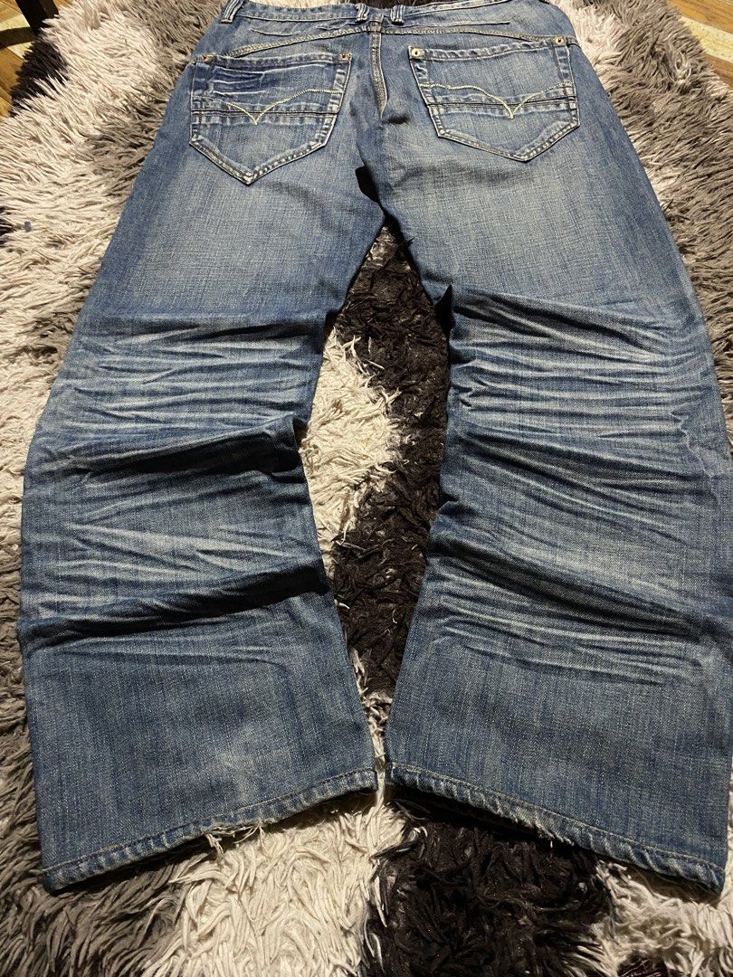 J&G Made In Italy bootcut (Category: Jeans) located in Caloocan City. Submitted by remythrift (Listing ID 1466912791, Image 1). Description: - Brand: J&G (Made in Italy) - Size: 34 - Wash: Mid blue with heavy whiskering and fading - Fit: Straight leg with trendy distressed hems - Details: Classic 5-pocket design, contrast yellow stitching, and branded black inner waistband tag - Condition: Excellent pre-loved condition - Mode of Payment: GCash, B