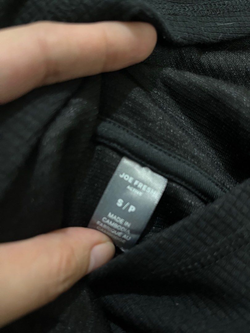 Joe Fresh Activewear Pull Over Hoodie Black (Category: Coats, Jackets and Outerwear) located in Cebu City. Submitted by purgemycloset (Listing ID 1466633179, Image 3). Description: Joe Fresh black activewear pullover hoodie available in small & Large. Features a textured waffle knit fabric, long sleeves, attached hood, and a curved hem. Comfortable blend of polyester, cotton, and spandex. Great for workouts or casual wear!.