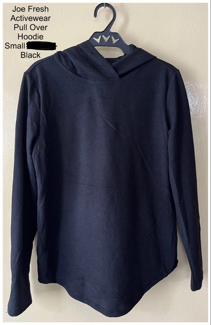 Joe Fresh Activewear Pull Over Hoodie Black (Category: Coats, Jackets and Outerwear) located in Cebu City. Submitted by purgemycloset (Listing ID 1466633179, Image 1). Description: Joe Fresh black activewear pullover hoodie available in small & Large. Features a textured waffle knit fabric, long sleeves, attached hood, and a curved hem. Comfortable blend of polyester, cotton, and spandex. Great for workouts or casual wear!.