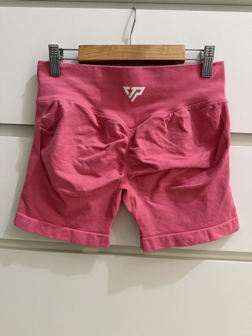 KeepThatPump Pink Gym Shorts Ruched Butt Size M (Category: Activewear) located in Makati City. Submitted by lvshop_mnl (Listing ID 1466835890, Image 2). Description: - Brand: KeepThatPump - Color: Bright Pink - Size: Medium - Material: 90% Nylon, 10% Elastane (Super stretchy) - Features: Ribbed high waistband and flattering back ruching - Details: White brand logo near the top back - Condition: Great for workouts and activewear.