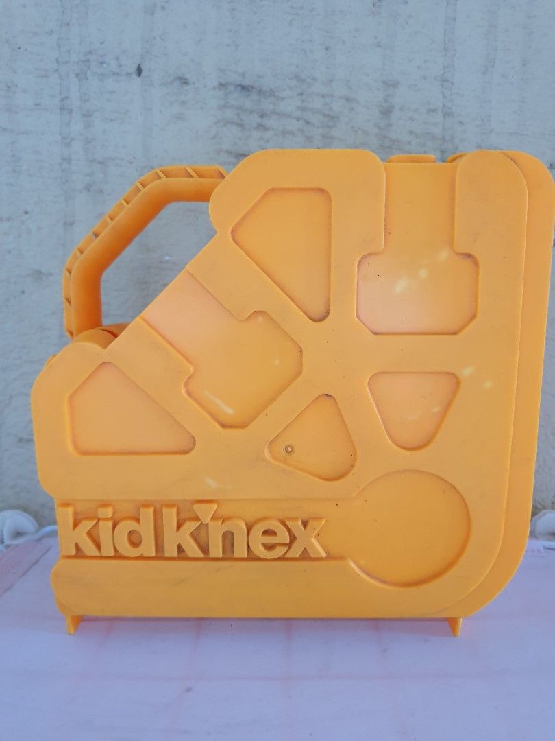 Kid K'Nex My Fun Book Building Set with Storage Case (Category: Educational & Learning Toys) located in Las Pinas. Submitted by anggesmart (Listing ID 1466785908, Image 1). Description: - Kid K'Nex starter building set for young kids - Includes colorful plastic pieces, gears, and connectors - Comes with 'My Fun Book' building guide - Convenient orange plastic storage case with a handle for easy cleanup and portability.