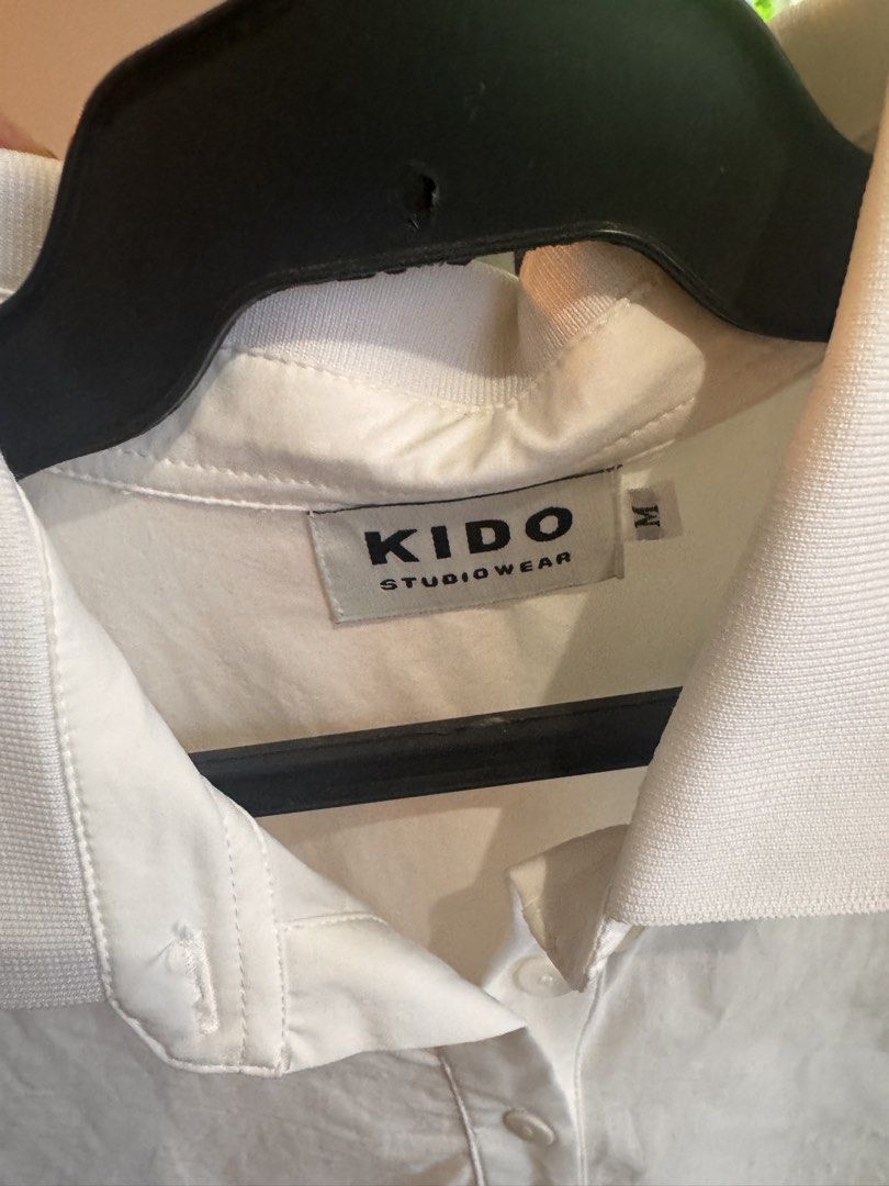 Kido polo top from Vietnam (Category: Shirts) located in Quezon City. Submitted by essief (Listing ID 1466917452, Image 2). Description: - Bought from local Vietnamese brand, KIDO - Very comfy material and stylish - Comes with adjustable strings on the bottom so you can wear it in 2 ways ☺️ - Worn once only! No when worn photos .
