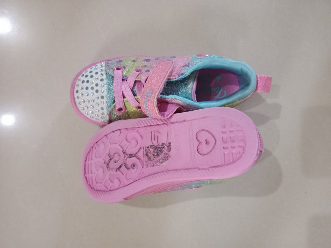 Kids Shoes US 9-10 take all (Category: Babies & Kids Fashion) located in Manila. Submitted by coolmoon.6a41a1 (Listing ID 1466791306, Image 2). Description: - Brand: Skechers Twinkle Toes - Size: US 9 - Design: Colorful pastel rainbow glitter with sparkly rhinestone toe caps - Closure: Easy pink hook-and-loop strap over elastic laces - Sole: Durable pink rubber with fun heart patterns underneath - Condition/Usage: Great everyday sneakers for kids