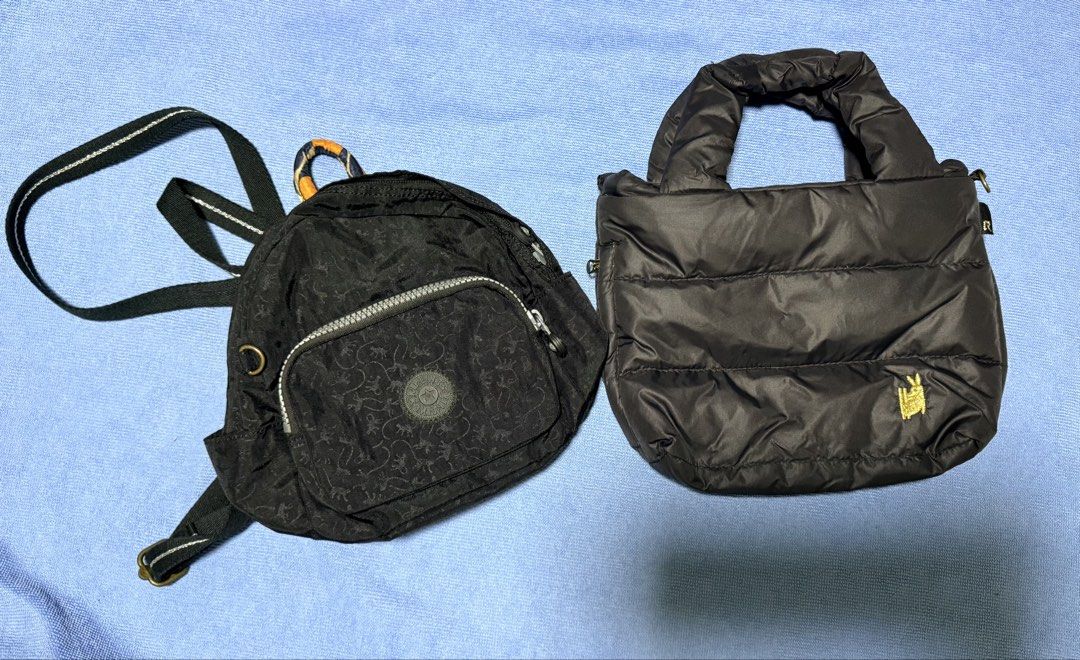 Kipling Mini Backpack and Rootote Puffer Handbag Bundle (Category: Backpacks) located in Dasmarinas. Submitted by toyang50 (Listing ID 1466775144, Image 1). Description: Two bags bundled together. First bag is a black Kipling mini backpack with all-over monkey print, front zip pocket, and patterned interior lining. Made in China, Second bag is a black Rootote puffer handbag with quilted design, gold rabbit emblem, and silver-toned R logo zipper p