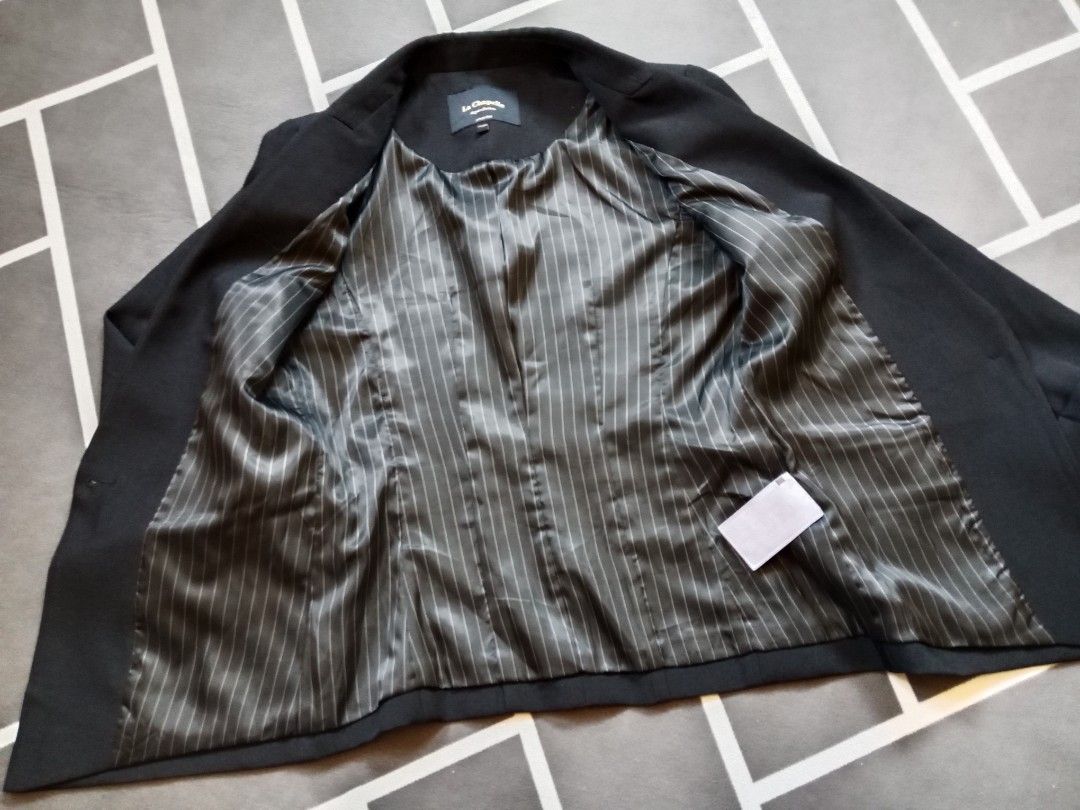 La Chapelle Black Blazer Jacket Size 155/80A (Category: Coats, Jackets and Outerwear) located in Baguio. Submitted by jooeeeyyyy_ (Listing ID 1466810196, Image 3). Description: - Brand: La Chapelle - Size: 155/80A - Color: Classic Black - Closure: Single-button front with branded hardware - Interior: Stylish striped satin lining - Features: Structured fit with functional hip flap pockets - Condition: Pristine, clean fabric inside and out.