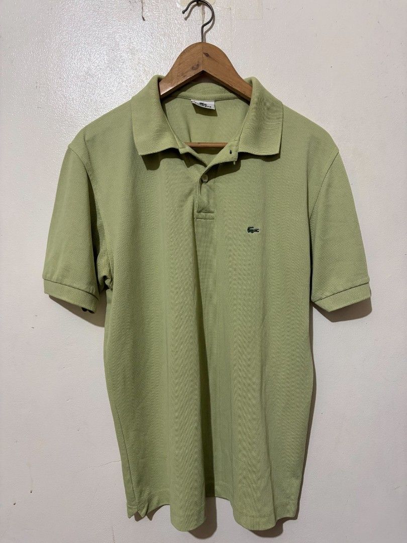 Lacoste Light Green Polo Shirt Size 5 (Category: Tshirts & Polo Shirts ) located in Caloocan City. Submitted by Tulokss (Listing ID 1466967220, Image 1). Description: - Brand: Lacoste - Color: Light green - Size: 5 - Material: 100% breathable cotton - Design: Classic two-button placket with ribbed collar and sleeve cuffs - Details: Iconic embroidered crocodile logo on the left chest - Condition: Clean inner tags and care label intact.