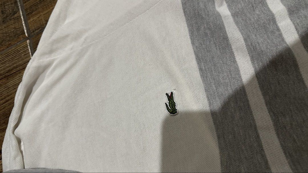 LACOSTE STRIPE (Category: Tshirts & Polo Shirts ) located in Manila. Submitted by urban.vintage (Listing ID 1466786792, Image 3). Description: ISSUE: PINHOLE (NEED WASH) MOP :GCASH (NO COD) SHIP VIA: LALAMOVE & J&T LOCATION: PASIG CITY LENGTH: 30 WIDTH : 19.