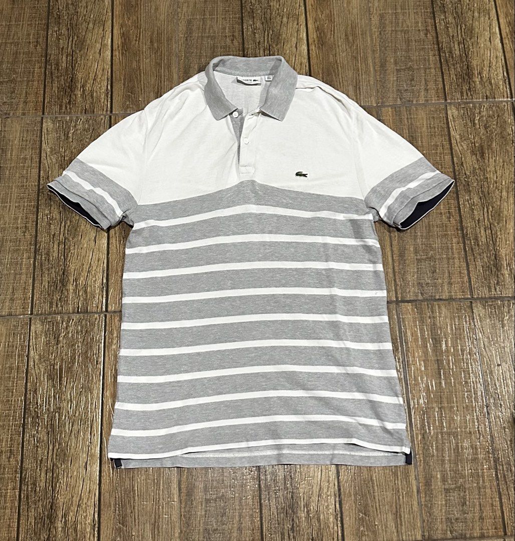 LACOSTE STRIPE (Category: Tshirts & Polo Shirts ) located in Manila. Submitted by urban.vintage (Listing ID 1466786792, Image 1). Description: ISSUE: PINHOLE (NEED WASH) MOP :GCASH (NO COD) SHIP VIA: LALAMOVE & J&T LOCATION: PASIG CITY LENGTH: 30 WIDTH : 19.