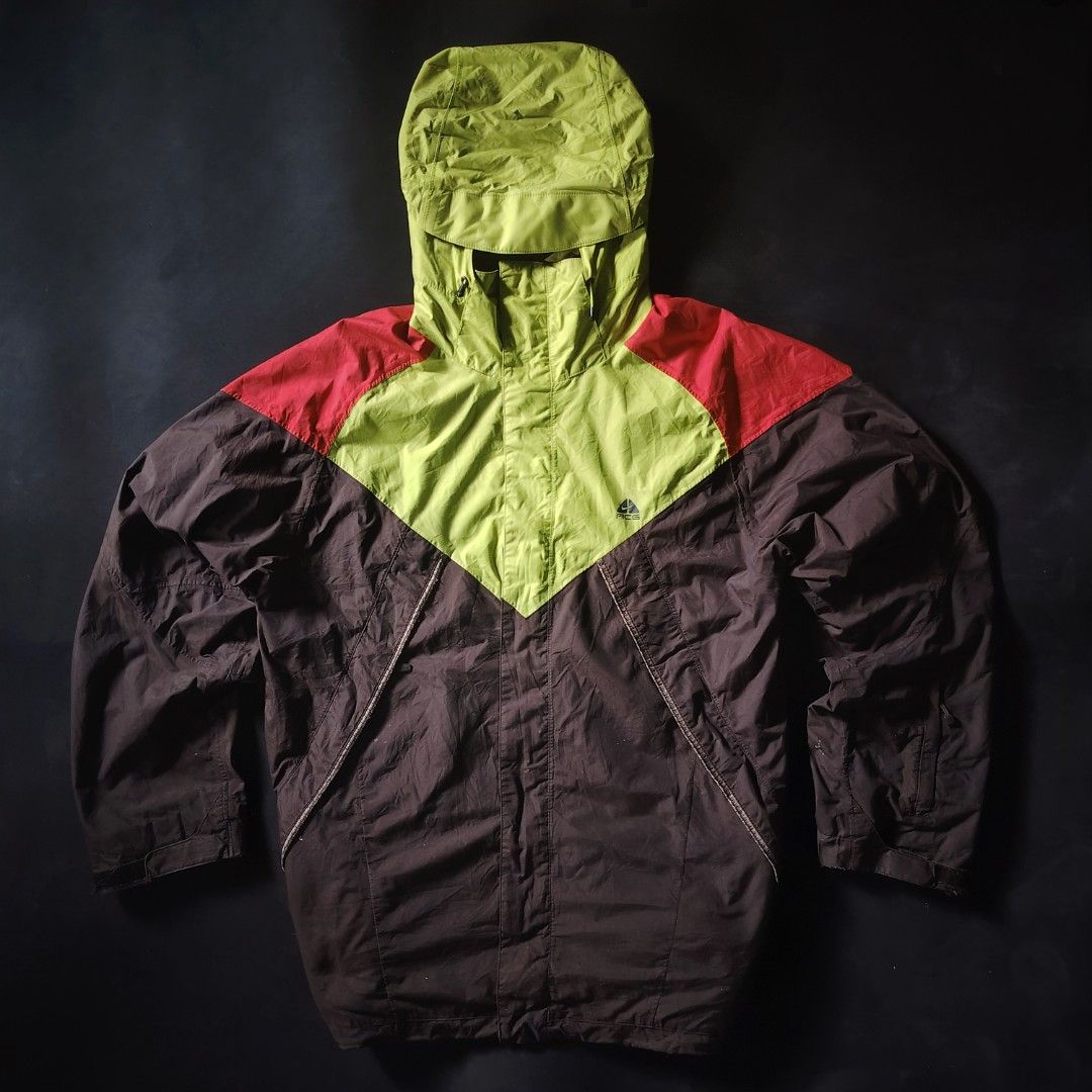 Late 90s/Early 00s Nike ACG Storm-FIT Technical Shell Jacket (Category: Coats, Jackets and Outerwear) located in General Santos City (Dadiangas). Submitted by angelodemegilloceballos (Listing ID 1466831218, Image 1). Description: - Brand: Nike ACG - Style: Vintage outdoor outer layer jacket with Storm-FIT technology - Colorway: Brown, lime green, and red color blocking - Size: Large - Details: Hooded with adjustable drawstrings, ACG chest logo, m