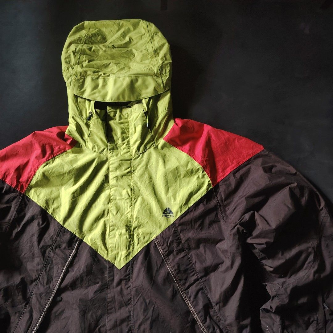 Late 90s/Early 00s Nike ACG Storm-FIT Technical Shell Jacket (Category: Coats, Jackets and Outerwear) located in General Santos City (Dadiangas). Submitted by angelodemegilloceballos (Listing ID 1466831218, Image 2). Description: - Brand: Nike ACG - Style: Vintage outdoor outer layer jacket with Storm-FIT technology - Colorway: Brown, lime green, and red color blocking - Size: Large - Details: Hooded with adjustable drawstrings, ACG chest logo, m
