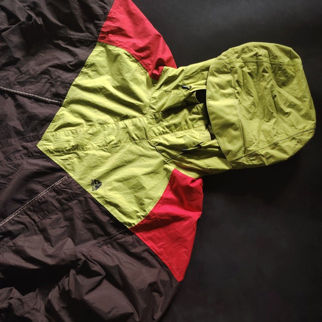 Late 90s/Early 00s Nike ACG Storm-FIT Technical Shell Jacket (Category: Coats, Jackets and Outerwear) located in General Santos City (Dadiangas). Submitted by angelodemegilloceballos (Listing ID 1466831218, Image 3). Description: - Brand: Nike ACG - Style: Vintage outdoor outer layer jacket with Storm-FIT technology - Colorway: Brown, lime green, and red color blocking - Size: Large - Details: Hooded with adjustable drawstrings, ACG chest logo, m