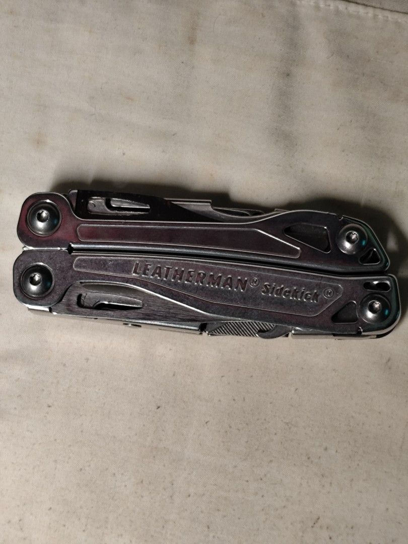Leatherman Sidekick Multitool (Category: Home Improvement Tools & Accessories) located in Dasmarinas. Submitted by brianrk (Listing ID 1466907913, Image 1). Description: - Brand: Leatherman Sidekick Multitool - Material: Durable stainless steel with a solid build - Condition: Shows normal signs of handling and minor surface wear, fully functional - Key Features: Smooth spring-action pliers and easy-fold tools on both handles - Convenience: Comes 