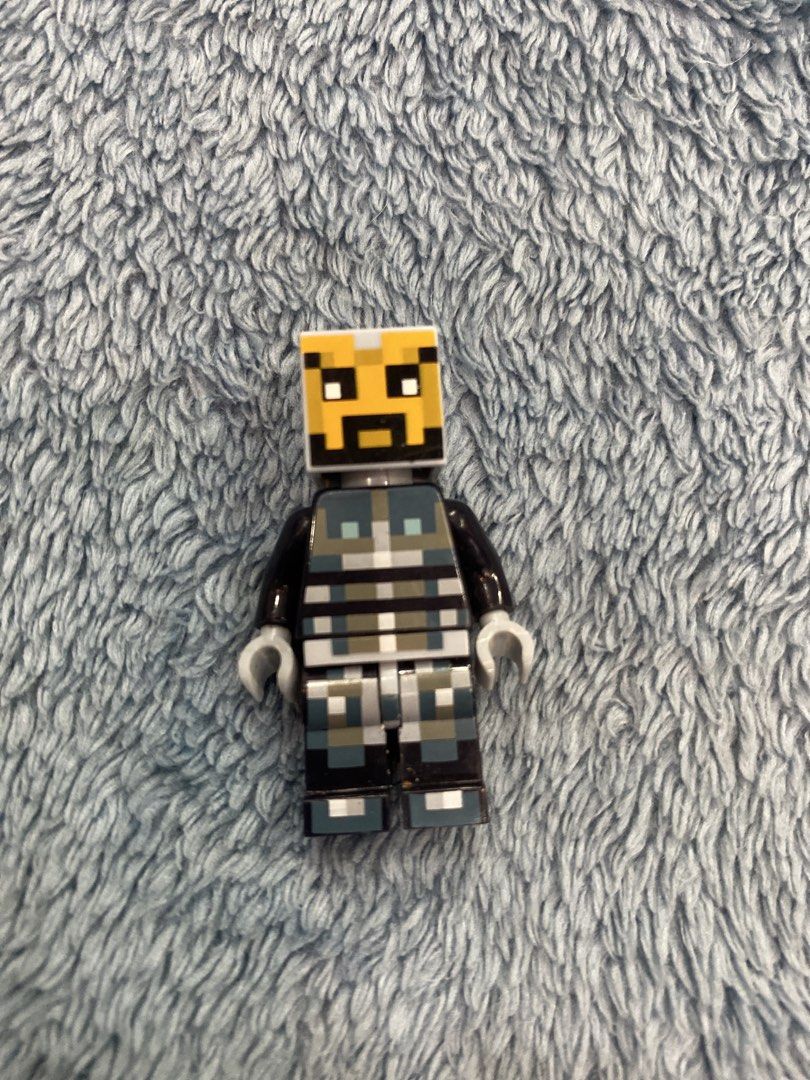 LEGO Minecraft Skin 5 Minifigure (Category: Lego & Building Sets) located in Manila. Submitted by j9e0fri_2025 (Listing ID 1466949474, Image 1). Description: - Character: LEGO Minecraft Steve with gold helmet and gold armor - Condition: Excellent, adult collector-owned from a smoke-free home - Details: Black arms, light grey hands, and classic pixelated block print on torso and legs - Usage: Great addition to any Lego Minecraft Minifigure collect