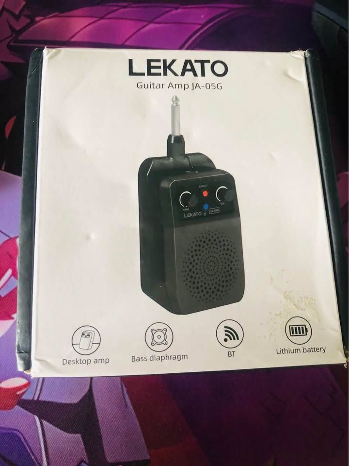 LEKATO Guitar Amp JA-05G (Category: Musical Instruments) located in Calamba. Submitted by joshuacasupang (Listing ID 1466868843, Image 2). Description: - LEKATO JA-05G pocket guitar amplifier in sleek black - Plugs straight into your electric guitar for instant playing - Built-in Bluetooth and rechargeable lithium battery for wireless convenience - Features tone/volume dials and a bass diaphragm for solid sound - Includes original retail box, per