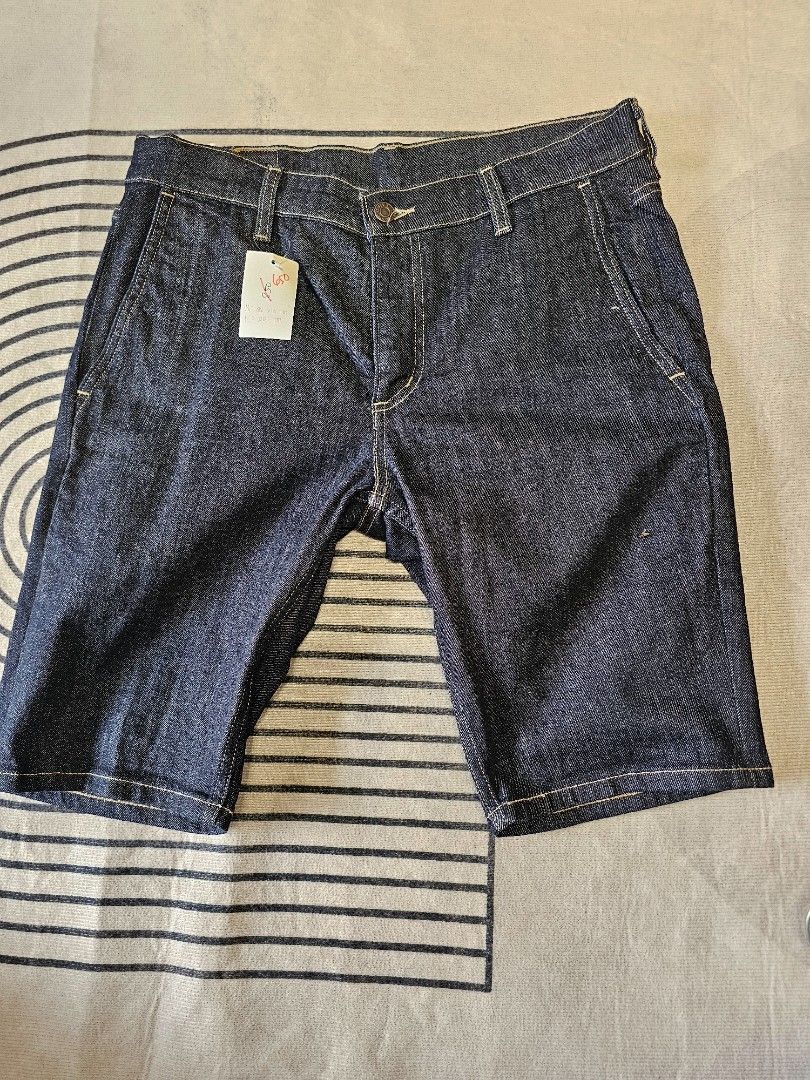 Levi dark denim Shorts (Category: Shorts) located in Baguio. Submitted by kayeonlineshop (Listing ID 1466871116, Image 1). Description: dark rinse Levi's denim shorts, featuring classic contrast stitching, slanted trouser-style front pockets, and a clean, structured finish. w33l20h16.5.