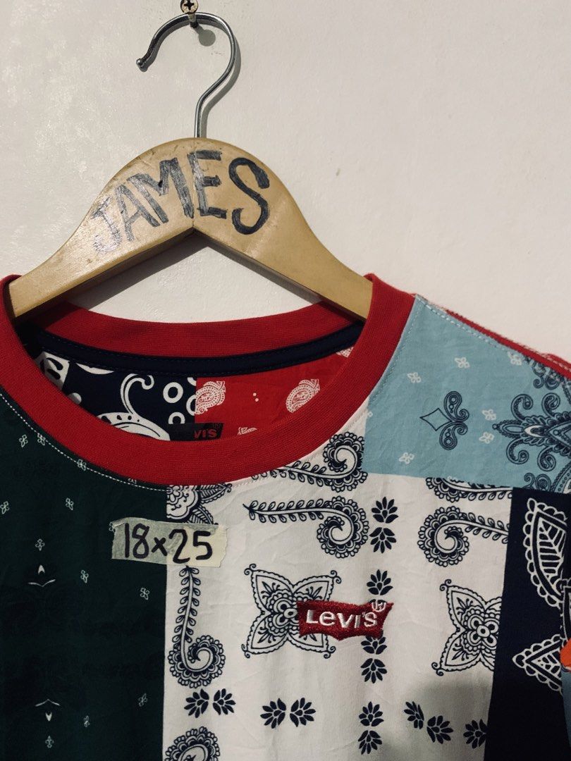 Levi's Bandana Patchwork T-Shirt Multi Color (Category: Shirts) located in Manila. Submitted by tanjames.14 (Listing ID 1466891379, Image 2). Description: - Brand: Levi's - Condition: Brand new with tags (BNWT) - Design: Colorful all-over bandana patchwork print with a red ribbed collar - Details: Small embroidered Levi's logo patch on the chest - Measurements: 18" pit-to-pit, 25" length - Perfect for adding a unique, streetwear touch to your out