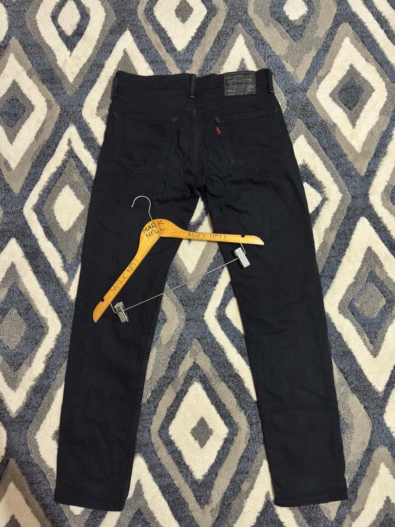 Levi's Black Denim Jeans (Category: Jeans) located in Caloocan City. Submitted by mrknll (Listing ID 1466870300, Image 2). Description: - Brand: Levi's - Color: Classic black with clean dark wash - Fit/Style: Everyday staple with minimal fading - Closure: Standard button fly - Pockets: Classic five-pocket layout - Details: Back leather patch and signature red tab branding.