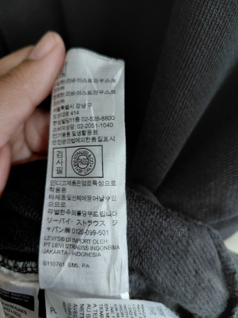 Levi's Black Knit Sweater Size L (Category: Coats, Jackets and Outerwear) located in Baguio. Submitted by undressme24 (Listing ID 1466894790, Image 1). Description: - Brand: Levi's - Color: Classic Black - Size: Large - Material/Origin: Made in Pakistan - Style: Crew neck with ribbed collar, cuffs, and hem - Fit: Standard fit for everyday wear - Condition: Clean and versatile piece that matches any outfit.