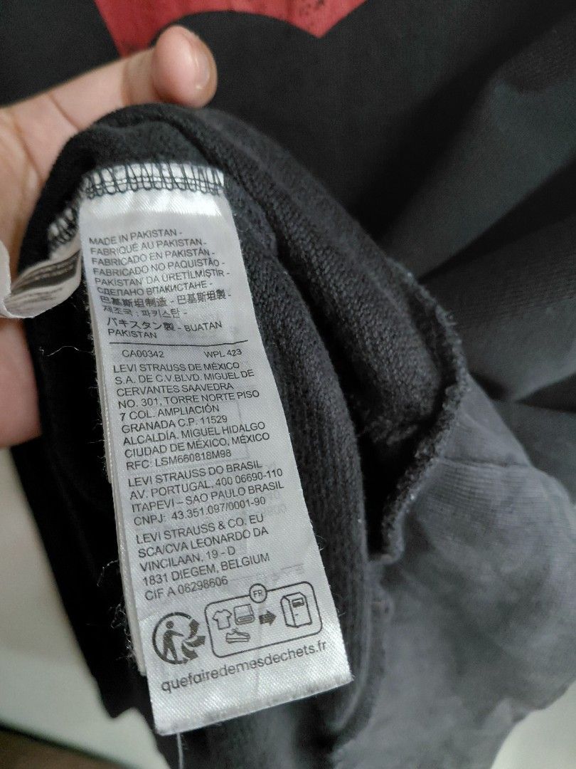 Levi's Black Knit Sweater Size L (Category: Coats, Jackets and Outerwear) located in Baguio. Submitted by undressme24 (Listing ID 1466894790, Image 2). Description: - Brand: Levi's - Color: Classic Black - Size: Large - Material/Origin: Made in Pakistan - Style: Crew neck with ribbed collar, cuffs, and hem - Fit: Standard fit for everyday wear - Condition: Clean and versatile piece that matches any outfit.