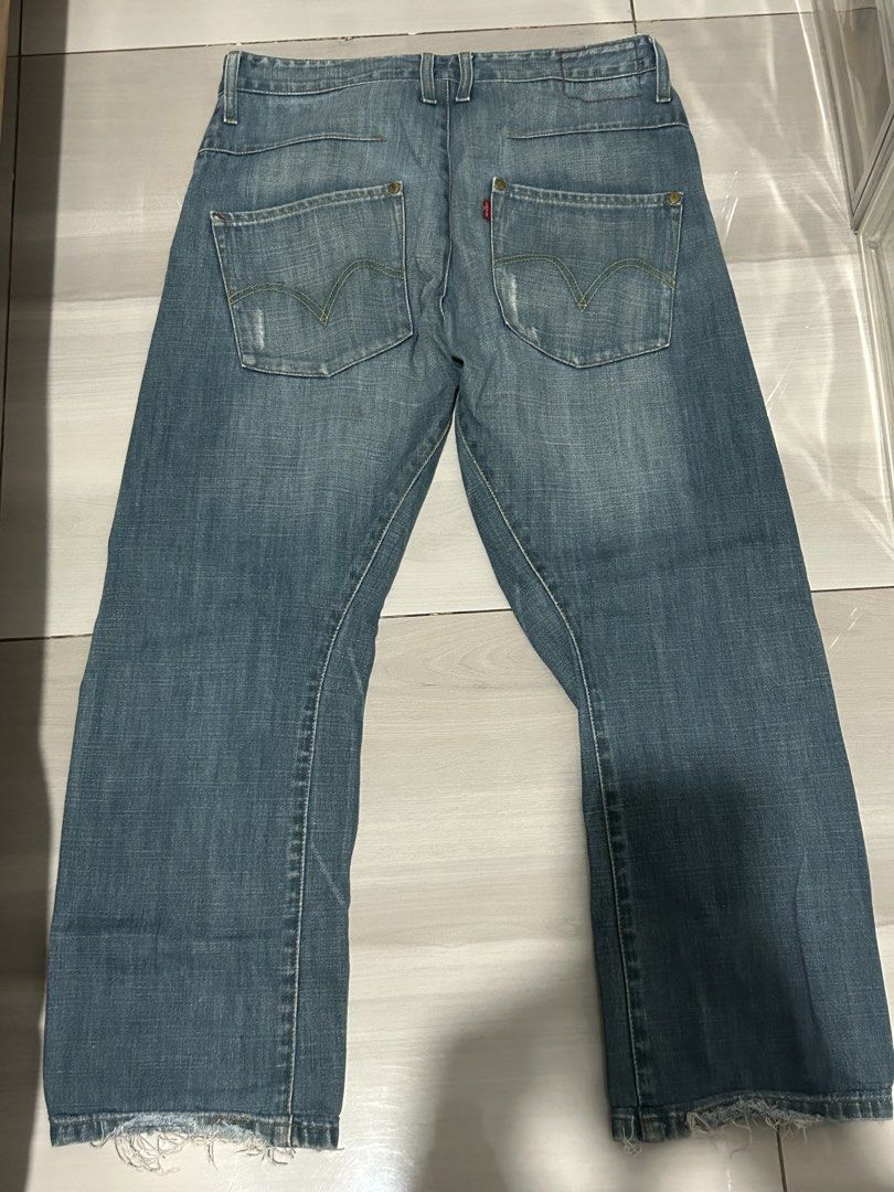 Levi's Blue Denim Jeans (Category: Jeans) located in Manila. Submitted by yarzkyhan (Listing ID 1466859364, Image 2). Description: - Negotiable price - Can do meetups around mnl - Brand: Levi's - Style: Classic five-pocket with button fly - Wash: Light wash with natural fading on thighs and knees - Details: Iconic red tab on back pocket, trendy raw frayed hems - Condition: Sturdy denim with great vintage character.