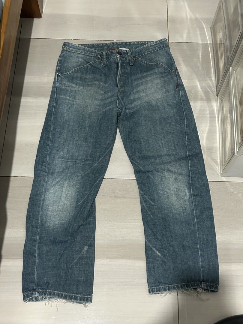 Levi's Blue Denim Jeans (Category: Jeans) located in Manila. Submitted by yarzkyhan (Listing ID 1466859364, Image 1). Description: - Negotiable price - Can do meetups around mnl - Brand: Levi's - Style: Classic five-pocket with button fly - Wash: Light wash with natural fading on thighs and knees - Details: Iconic red tab on back pocket, trendy raw frayed hems - Condition: Sturdy denim with great vintage character.