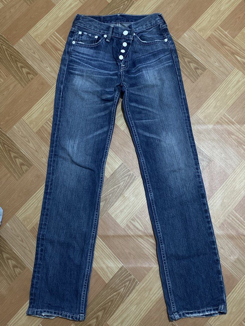 Levi's Button-Fly Denim Jeans (Category: Jeans) located in Manila. Submitted by zapitup (Listing ID 1466967023, Image 3). Description: - Brand: Levi's - Color: Classic blue wash with front fading - Fit: Regular fit, straight leg - Closure: Button fly with unique white buttons - Details: Distressed edges along pockets and hems - Material: 100% Cotton.