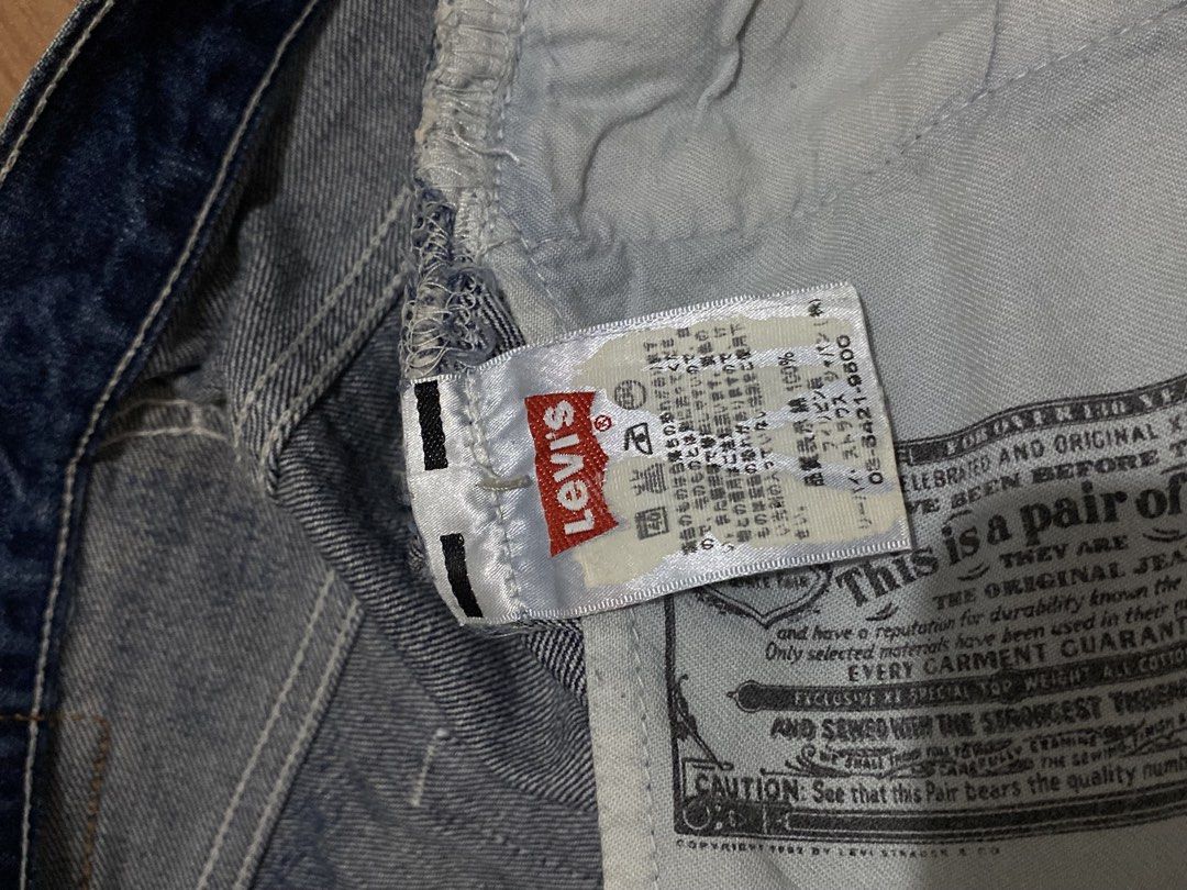 Levi's Button-Fly Denim Jeans (Category: Jeans) located in Manila. Submitted by zapitup (Listing ID 1466967023, Image 1). Description: - Brand: Levi's - Color: Classic blue wash with front fading - Fit: Regular fit, straight leg - Closure: Button fly with unique white buttons - Details: Distressed edges along pockets and hems - Material: 100% Cotton.