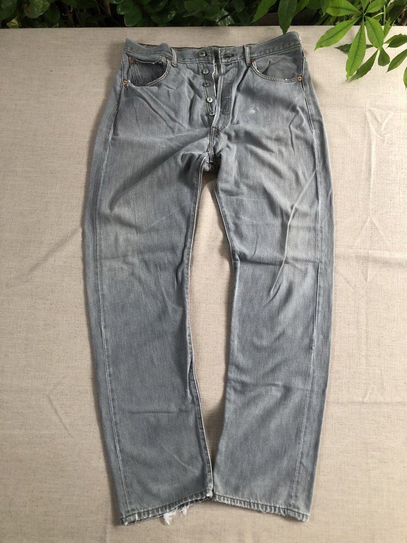 Levi's Grey Vintage Button-Fly Denim Jeans (Category: Jeans) located in Tarlac. Submitted by jds_thrift (Listing ID 1466835286, Image 2). Description: Vintage grey Levi's denim jeans with button-fly closure and classic back pocket stitching. Faded wash throughout with heavy distressing and visible professional reinforcement repairs at the crotch seam. Original leather patch intact on the back waistband. Heavy wear adds authentic character and bro