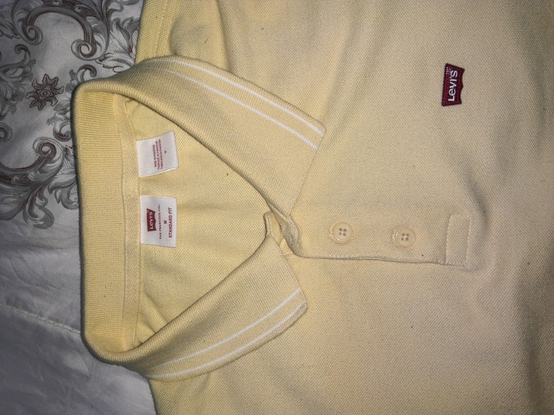 Levi's Yellow Polo Shirt Size M (Category: Tshirts & Polo Shirts ) located in Manila. Submitted by snooks1938 (Listing ID 1466873884, Image 2). Description: For Sale... YELLOW LEVI'S POLO SHIRT GOOD AS NEW.. - Brand: Levi's - Style: Standard fit polo shirt - Color: Yellow with white collar stripes - Details: Button placket, ribbed collar, and small red chest logo tab - Size: Medium FREE SHIPPING.. GLORY BE TO GOD.. .