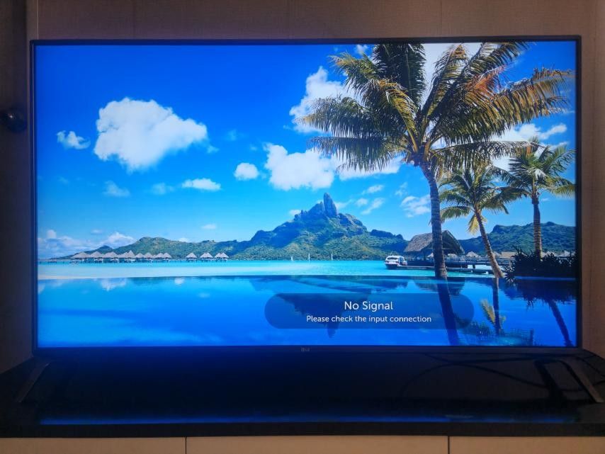 LG UHD (4K) HDR SMART TV (Category: TV) located in Quezon City. Submitted by gugumoochie49894 (Listing ID 1466856464, Image 2). Description: - Modern big screen TV with sleek, clean bezels and sturdy stand legs - Vivid display quality (shown with tropical island screensaver) - Includes original remote control - Excellent working condition - Only issue is Remote Power Button - Reason for selling: Upgrading to a larger size.