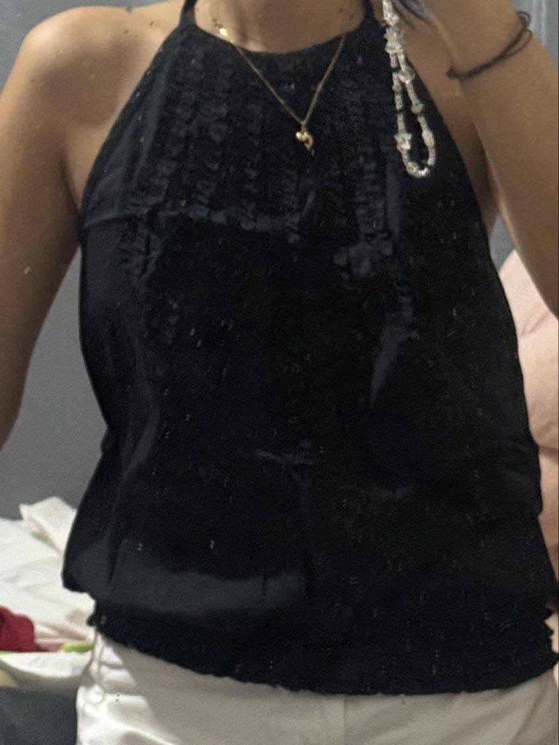 LIBÉ black ruffled halter neck backless top (Category: Sleeveless) located in Santa Rosa. Submitted by lovedby.gwy (Listing ID 1466842861, Image 3). Description: - brand: Libé (vietnamese brand) - fit: relaxed, slightly ballooned silhouette with an elasticized hem - naterial: lightweight and breathable for warm weather - worn once - large on tag but can only fit up to medium - rfs: too loose on me now cos i lost weight .