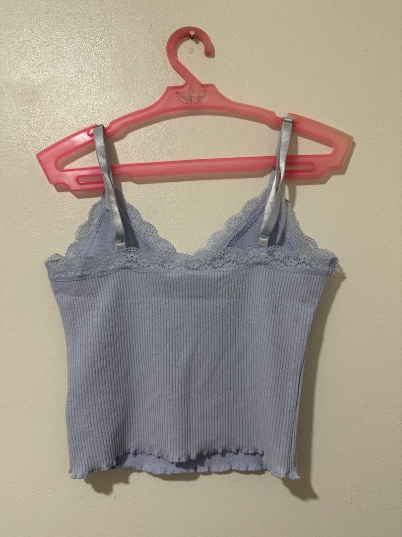 Light Purple Ribbed Cami with Lace Trim (Category: Sleeveless) located in Manila. Submitted by itsmerawrs (Listing ID 1466789595, Image 2). Description: - Color: Light purple - Material: Stretchy ribbed fabric - Design: V-neckline with delicate lace trim and chest detailing - Straps: Glossy satin and adjustable - Hem: Trendy lettuce hem at the bottom - Back: Straight cut with matching lace accent.