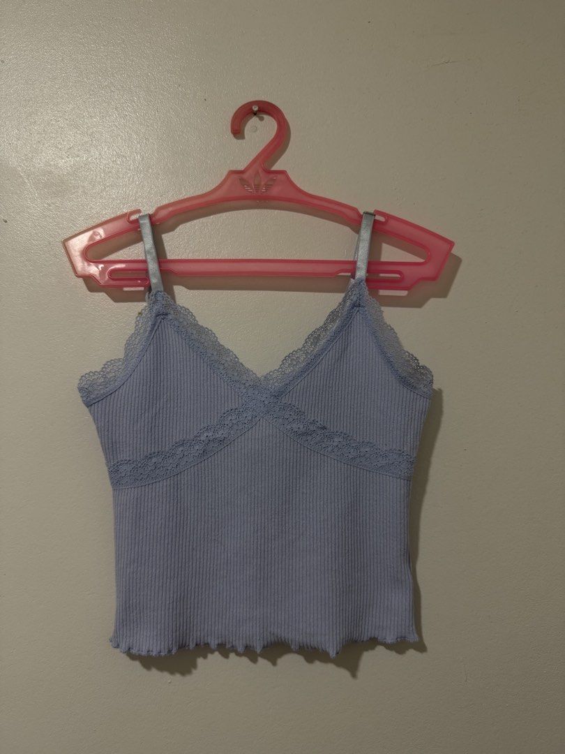 Light Purple Ribbed Cami with Lace Trim (Category: Sleeveless) located in Manila. Submitted by itsmerawrs (Listing ID 1466789595, Image 1). Description: - Color: Light purple - Material: Stretchy ribbed fabric - Design: V-neckline with delicate lace trim and chest detailing - Straps: Glossy satin and adjustable - Hem: Trendy lettuce hem at the bottom - Back: Straight cut with matching lace accent.
