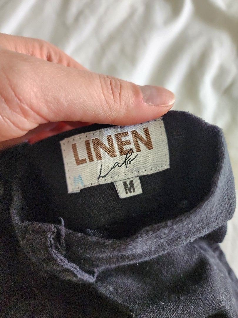 Linen Lab Black Wide Leg Linen Pants (Category: Jeans) located in Cebu City. Submitted by groovefunknsoul (Listing ID 1466864030, Image 2). Description: - Color: Dark grey - Material: Lightweight and breathable linen - Size: M (tagged on waistband) - Closure: Front button with belt loops - Fit: Relaxed, wide leg style.