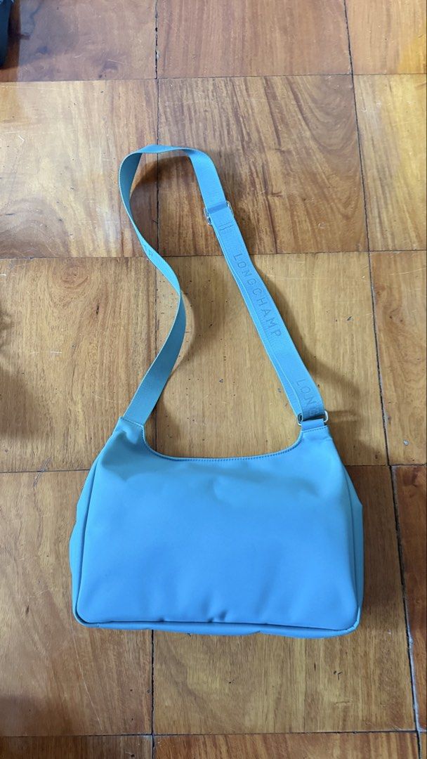 Longchamp Crossbody Messenger bag (Category: Cross-body Bags) located in Makati City. Submitted by thevault88 (Listing ID 1466858055, Image 2). Description: - Brand: Longchamp - Style: Crossbody / Messenger bag - Color: Teal Blue - Features: Front flap pocket, secure zipped main compartment, and branded adjustable strap - Condition: Good and well-maintained - Perfect for daily use, errands, or casual outings.