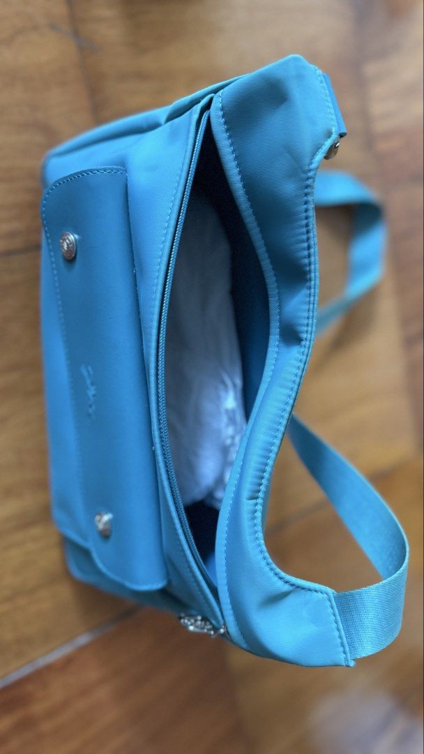 Longchamp Crossbody Messenger bag (Category: Cross-body Bags) located in Makati City. Submitted by thevault88 (Listing ID 1466858055, Image 3). Description: - Brand: Longchamp - Style: Crossbody / Messenger bag - Color: Teal Blue - Features: Front flap pocket, secure zipped main compartment, and branded adjustable strap - Condition: Good and well-maintained - Perfect for daily use, errands, or casual outings.