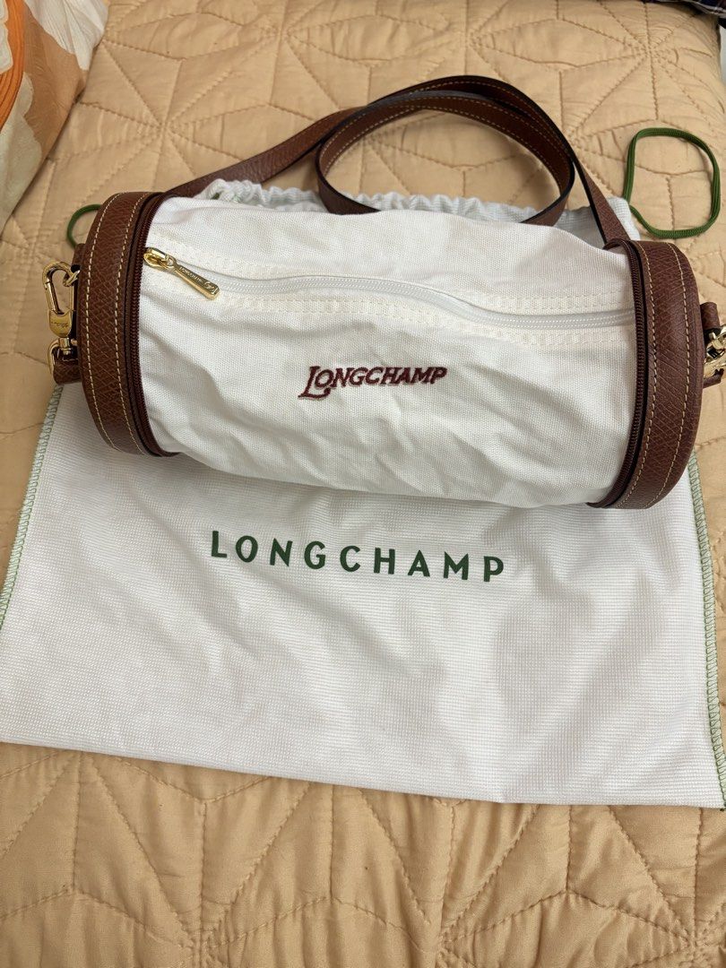Longchamp Round mini expandable (Category: Cross-body Bags) located in Manila. Submitted by budgetpreloveditems (Listing ID 1466881259, Image 3). Description: - Authentic Longchamp round crossbody bag in classic brown leather - Elegant gold-tone hardware with secure zip closure - Long, adjustable strap attached with convenient lobster clasps - Features clean, premium stitching throughout - Includes matching white Longchamp dust bag - Comes with a