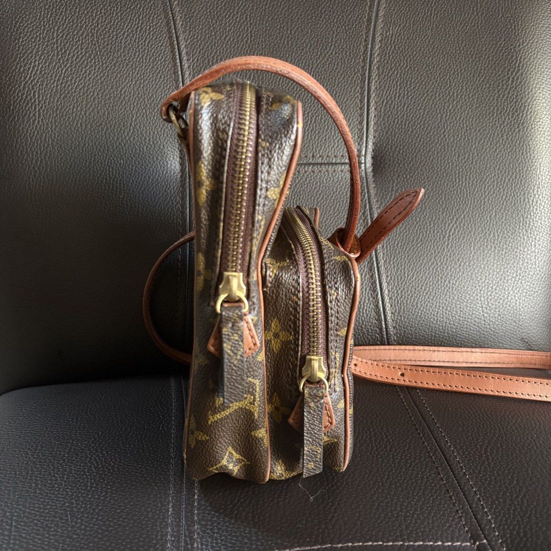 Louis Vuitton Amazone (Category: Luxury Accessories) located in Baliuag. Submitted by northfnds (Listing ID 1466860759, Image 3). Description: The image shows a vintage Louis Vuitton Monogram Amazone crossbody bag crafted in the signature brown monogram canvas with natural vachetta leather trim and an exterior front zip pocket.