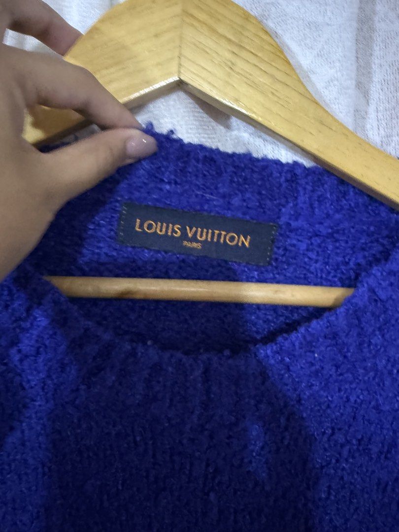 Louis Vuitton Blue Knit Sweater (Category: Longsleeves) located in Quezon City. Submitted by dapanaaaay (Listing ID 1466883587, Image 3). Description: - Brand: Louis Vuitton - Color: Vibrant blue with white embroidered LV logo patch on chest - Style: Classic crewneck, long sleeves, ribbed trims - Material: Soft and textured knit fabric - Condition: Excellent, inside label intact at the neckline - Authentic designer piece ready to wear.