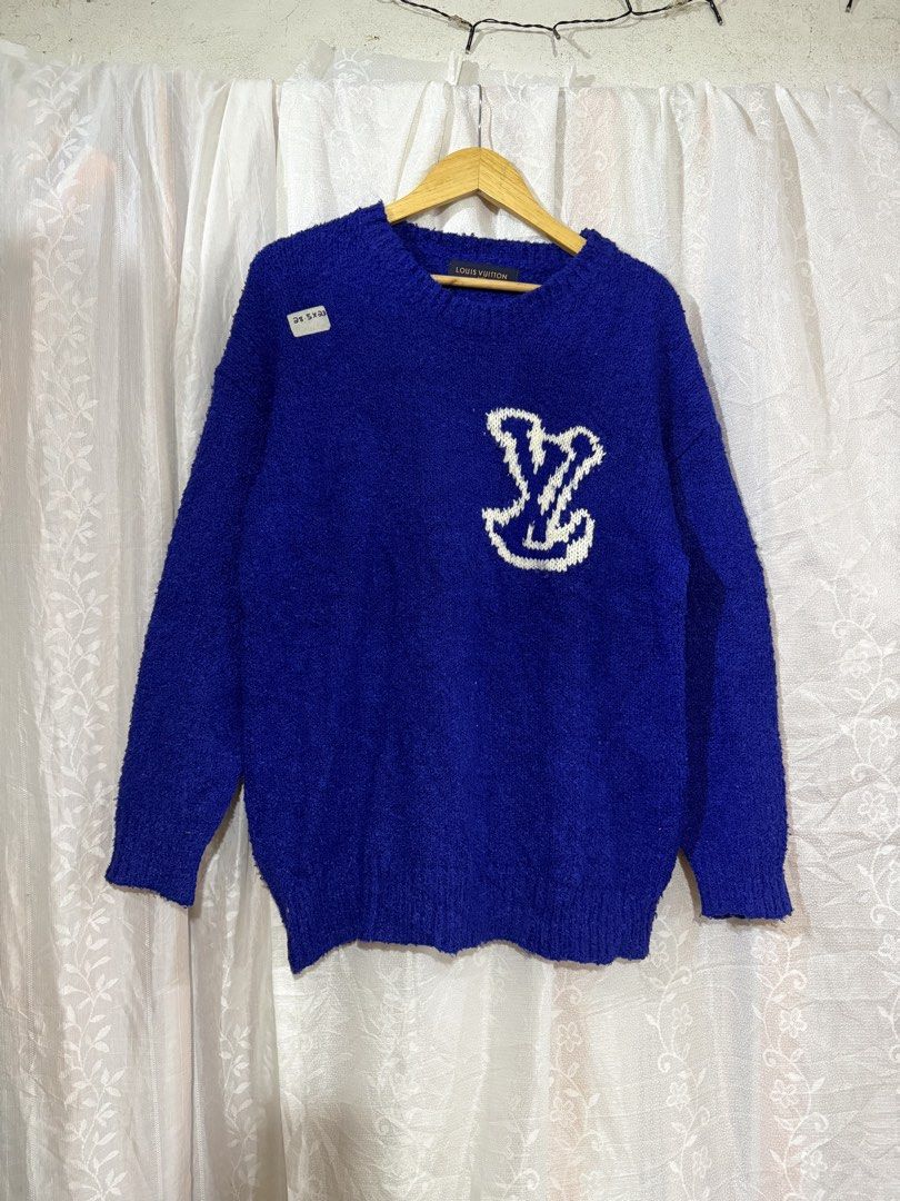 Louis Vuitton Blue Knit Sweater (Category: Longsleeves) located in Quezon City. Submitted by dapanaaaay (Listing ID 1466883587, Image 1). Description: - Brand: Louis Vuitton - Color: Vibrant blue with white embroidered LV logo patch on chest - Style: Classic crewneck, long sleeves, ribbed trims - Material: Soft and textured knit fabric - Condition: Excellent, inside label intact at the neckline - Authentic designer piece ready to wear.