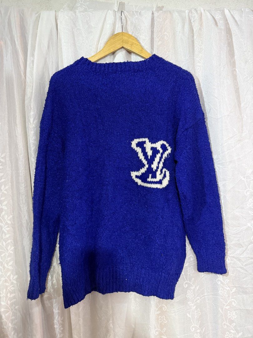 Louis Vuitton Blue Knit Sweater (Category: Longsleeves) located in Quezon City. Submitted by dapanaaaay (Listing ID 1466883587, Image 2). Description: - Brand: Louis Vuitton - Color: Vibrant blue with white embroidered LV logo patch on chest - Style: Classic crewneck, long sleeves, ribbed trims - Material: Soft and textured knit fabric - Condition: Excellent, inside label intact at the neckline - Authentic designer piece ready to wear.