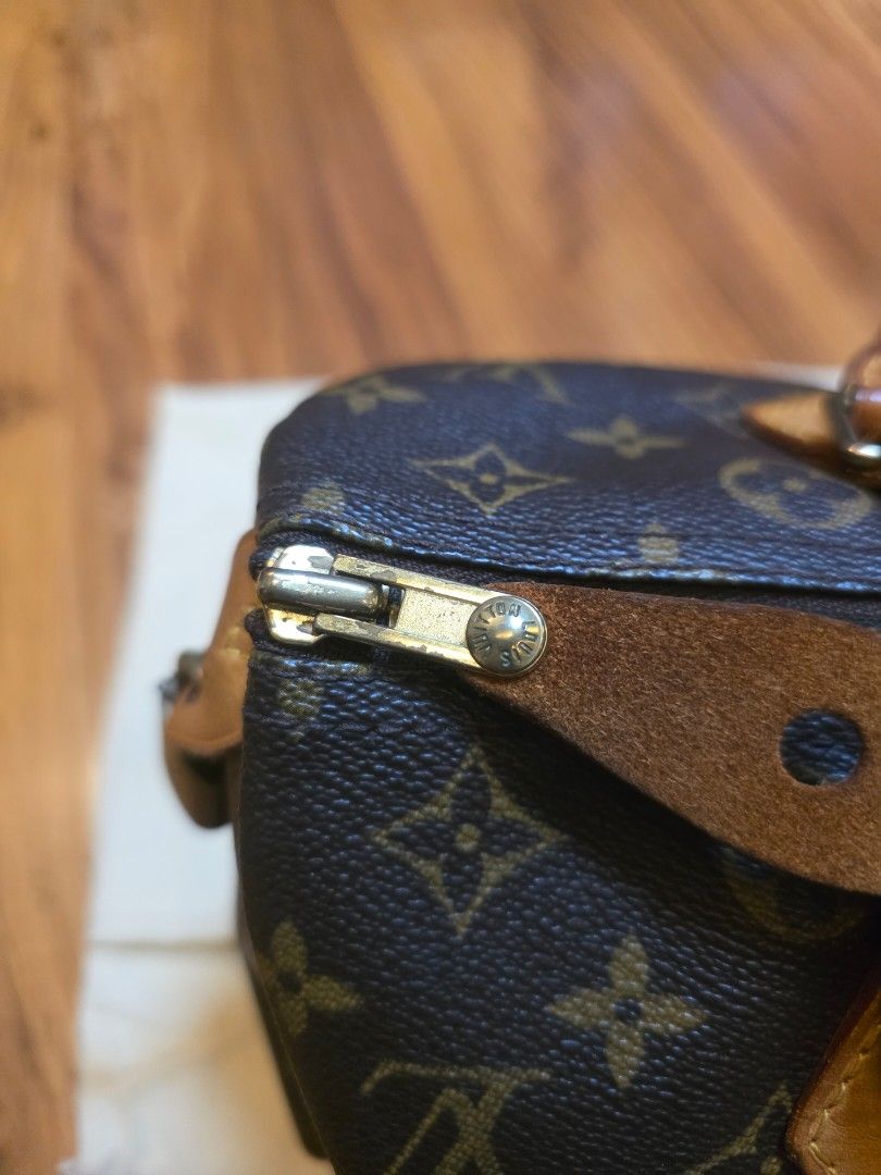 Louis Vuitton Monogram Canvas Handbag with Dust Bag (Category: Luxury Bags & Wallets) located in Iligan City. Submitted by ilovechocolatecakes (Listing ID 1466784197, Image 3). Description: - Authentic Classic Louis Vuitton monogram canvas handbag - Secure zipper closure with comfortable dual leather handles - Brown fabric-lined interior featuring convenient slip pocket compartments - Includes original cream-colored Louis Vuitton logo dust bag - 