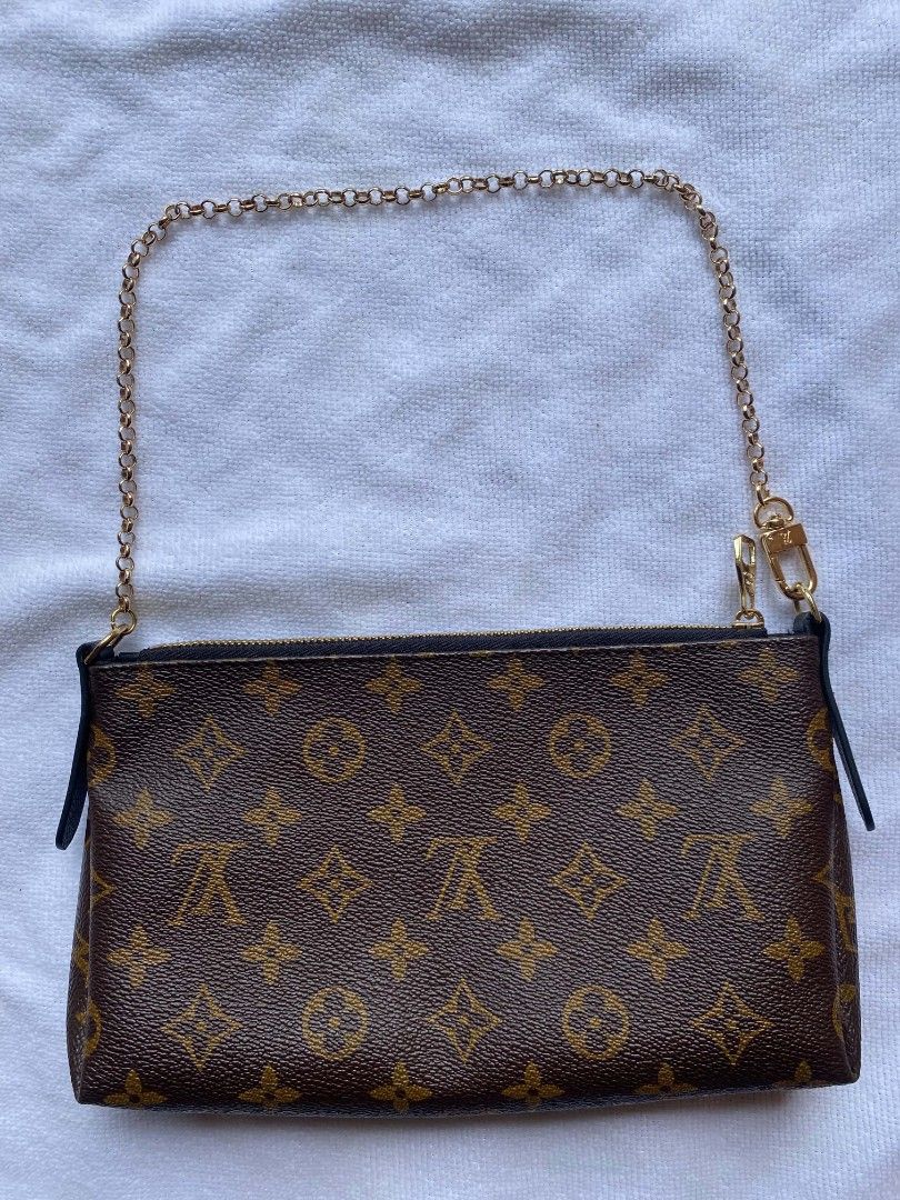 Louis Vuitton Monogram Canvas Multi Pochette Accessoires Pouch (Category: Luxury Bags & Wallets) located in Maco. Submitted by seidcaeeverydayfinds888 (Listing ID 1466909007, Image 2). Description: - Authentic Louis Vuitton monogram canvas pouch in classic brown and tan - Stylish black leather trim along the top opening and side tabs - Gleaming gold-tone hardware and secure zipper closure - Includes a removable gold chain strap with a convenient 